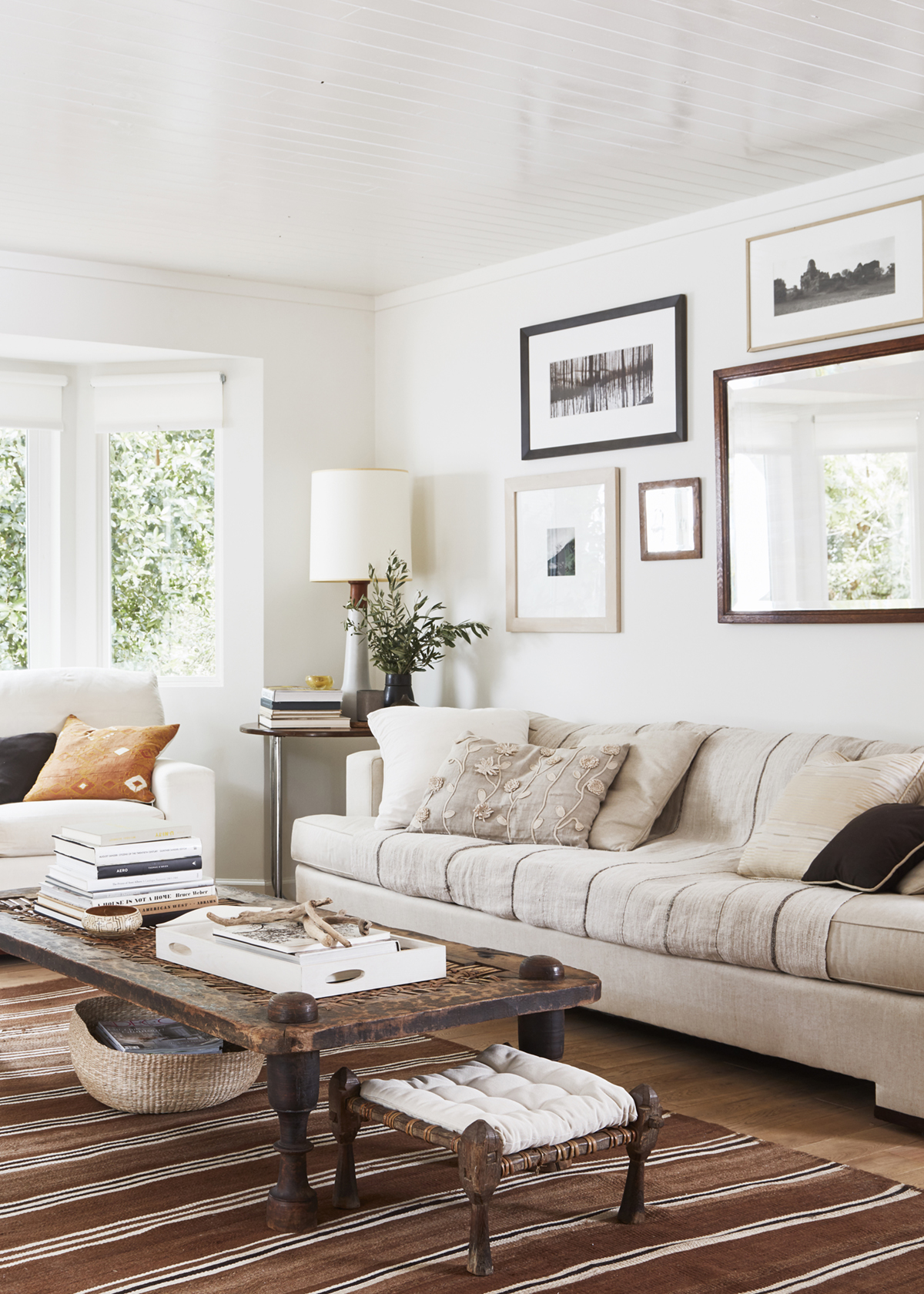 moroccan-textiles-and-antique-coffee-table-in-this-neutral-living-room-relaxed-ranch-house-tour-on-coco-kelley