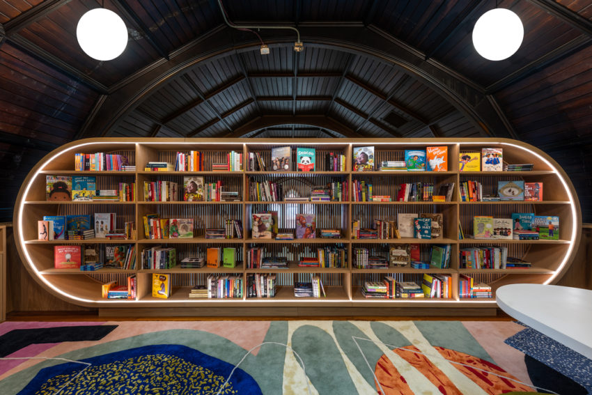 ChildrenE28099s-Library-lit-cubby-shelf-and-balcony-wall-850x567