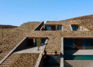 A Cave-Like Home Built into a Rocky Cove Overlooking the Aegean Sea
