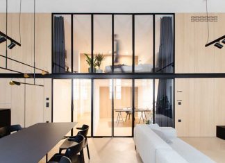 A Loft in Slovenia With Interior Windows Allowing for Natural Light