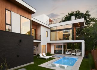 SLIC Design Creates a Modern Glass House That Rises to the Treetops