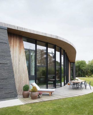 A Seaside Home Shaped Like a Boomerang in Risskov, Denmark